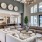 Resident clubhouse with high ceilings, wood floors, and warm lighting