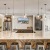 Community kitchen with large island with bar and barstools