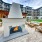 Fire pit in large courtyard with string lights overhead