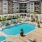 Large pool surrounded by apartment building
